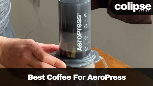 Person using an Aeropress coffee maker with Colipse Coffee branding.