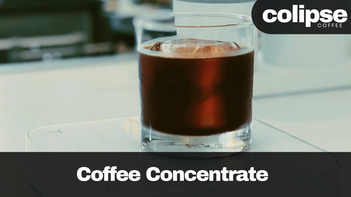 Glass of coffee concentrate with 'colipse Coffee' branding on a blurred background
