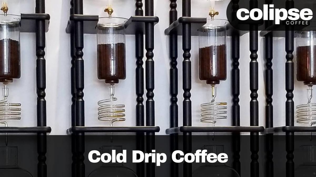 Cold drip coffee towers with spiral glass coils slowly brewing coffee