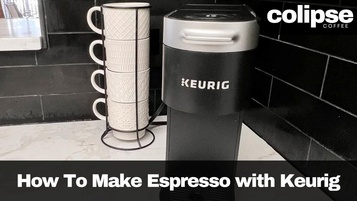 Keurig coffee maker with a stack of mugs on a tiled floor, featuring Colipse Coffee branding.