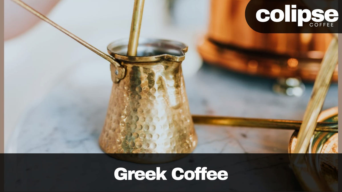 A hammered copper briki (small pot) with a long handle sits on a marble surface as it stirs or holds freshly brewed Greek coffee