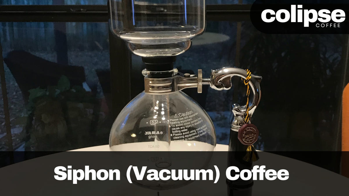 Siphon coffee apparatus on a table with 'Colipse Coffee' branding.