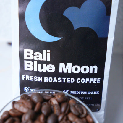 Bali Blue Moon coffee package with a bowl of coffee beans.
