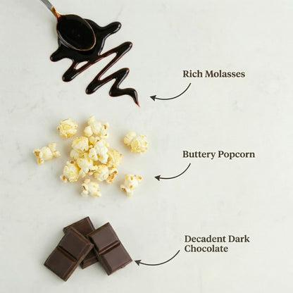 Buttery popcorn with dark chocolate and molasses on a light background