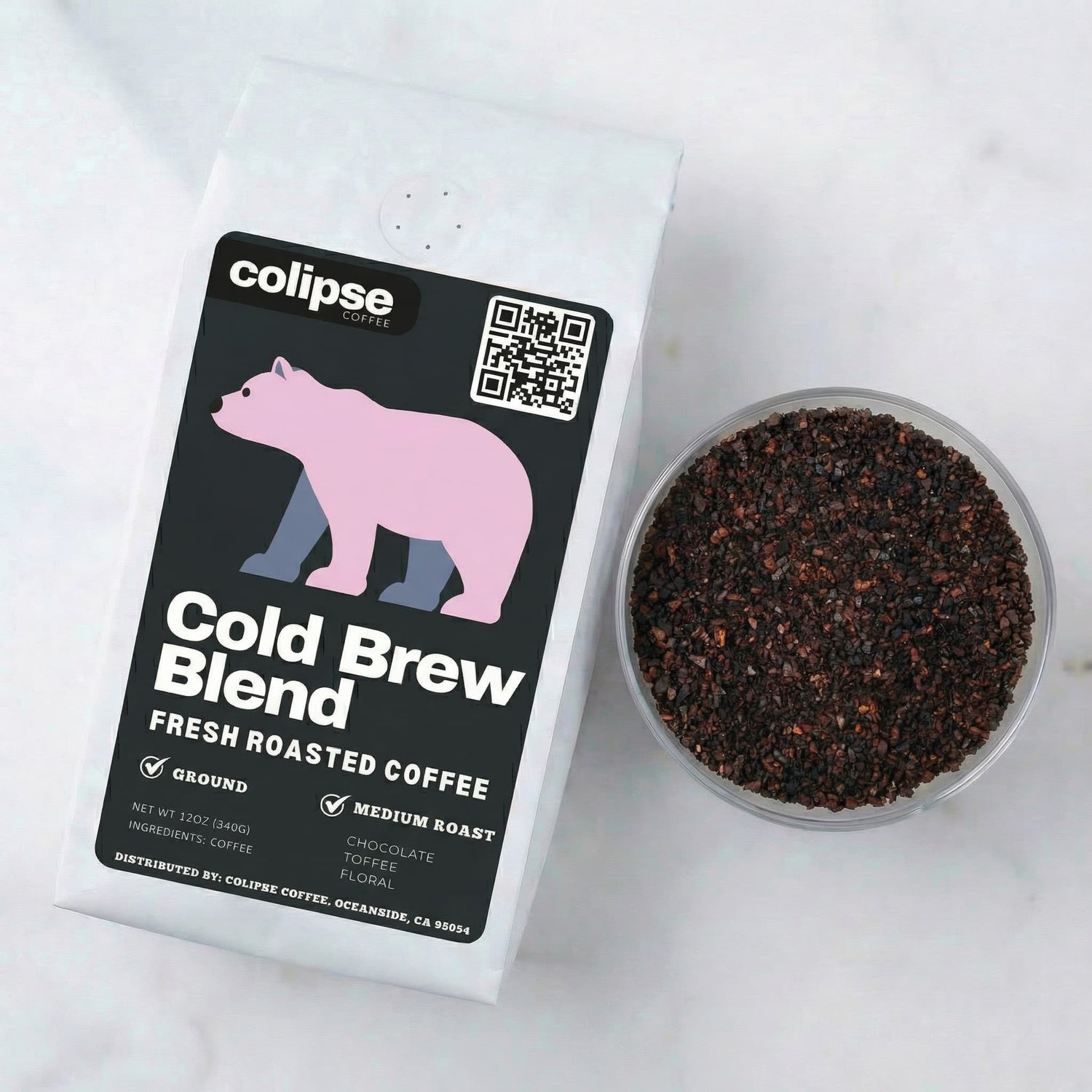 Colipse Coffee Cold Brew Blend packaging with ground coffee in a small bowl on a white background
