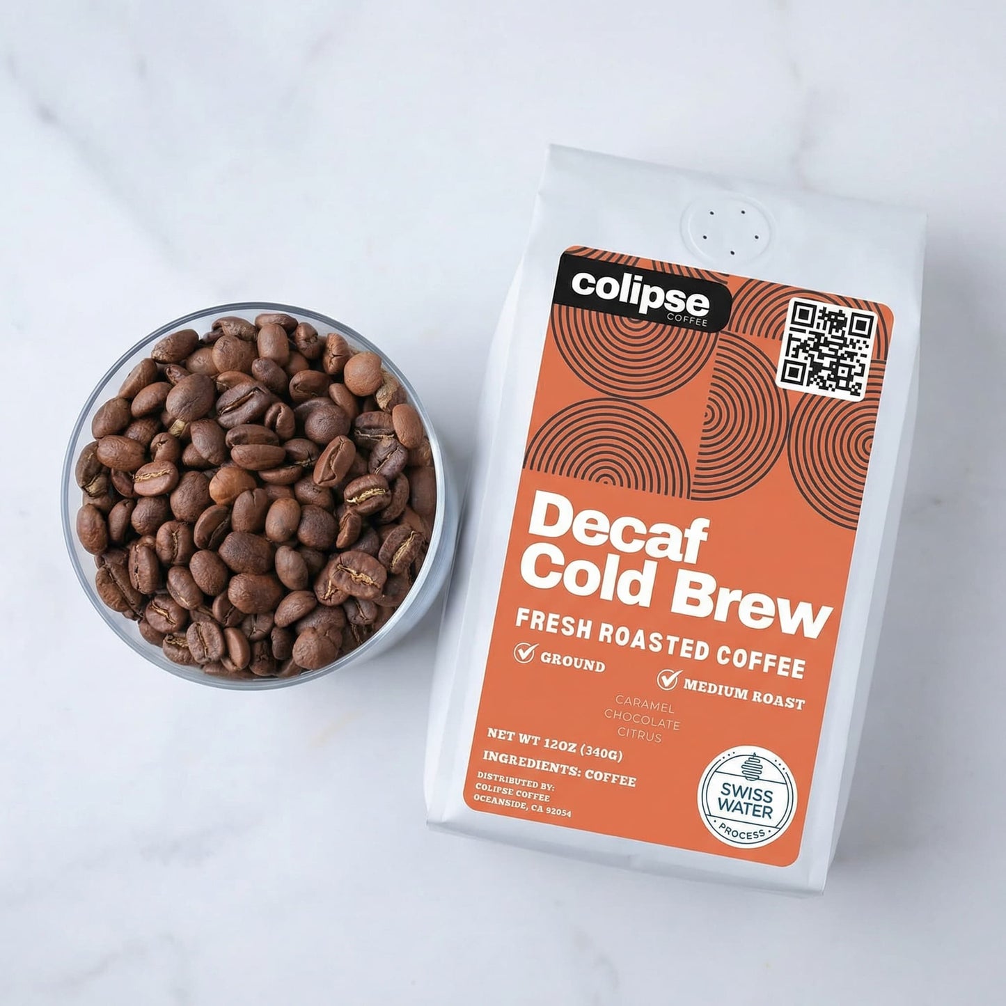 Decaf cold brew coffee package with a bowl of coffee beans on a white background