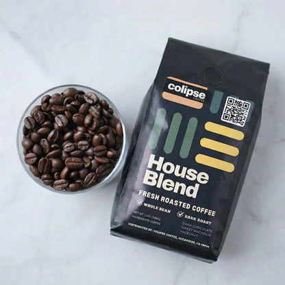 Colipse House Blend coffee package with a bowl of coffee beans on a white background
