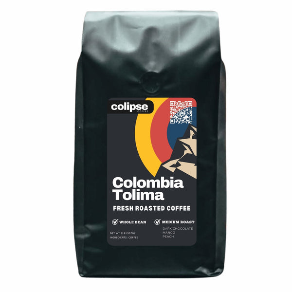 A bag of Colipse brand Colombia Tolima fresh roasted coffee, indicating whole bean and medium roast types.
