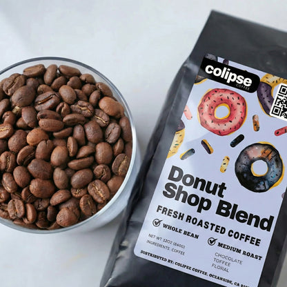 Colipse Donut Shop Blend coffee package with a bowl of coffee beans on a white background
