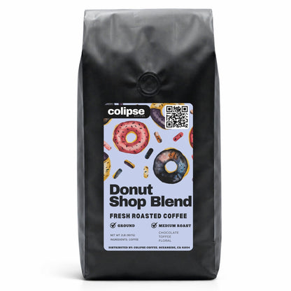 Black coffee bag with 'colipse' label featuring donut-themed design on a white background