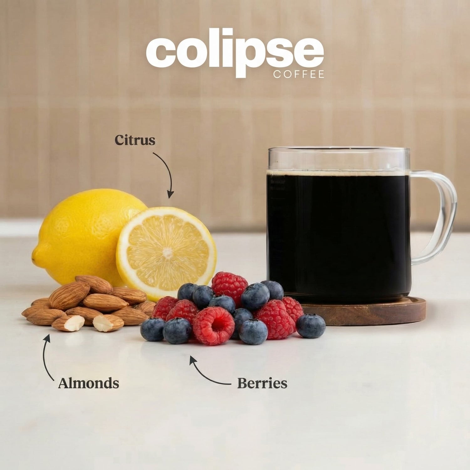 Mug of colipse coffee with lemons, almonds, and berries on a neutral background