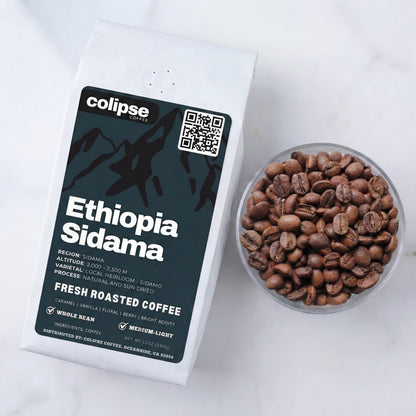 Colipse Ethiopia Sidama coffee packaging with a bowl of coffee beans on a white background