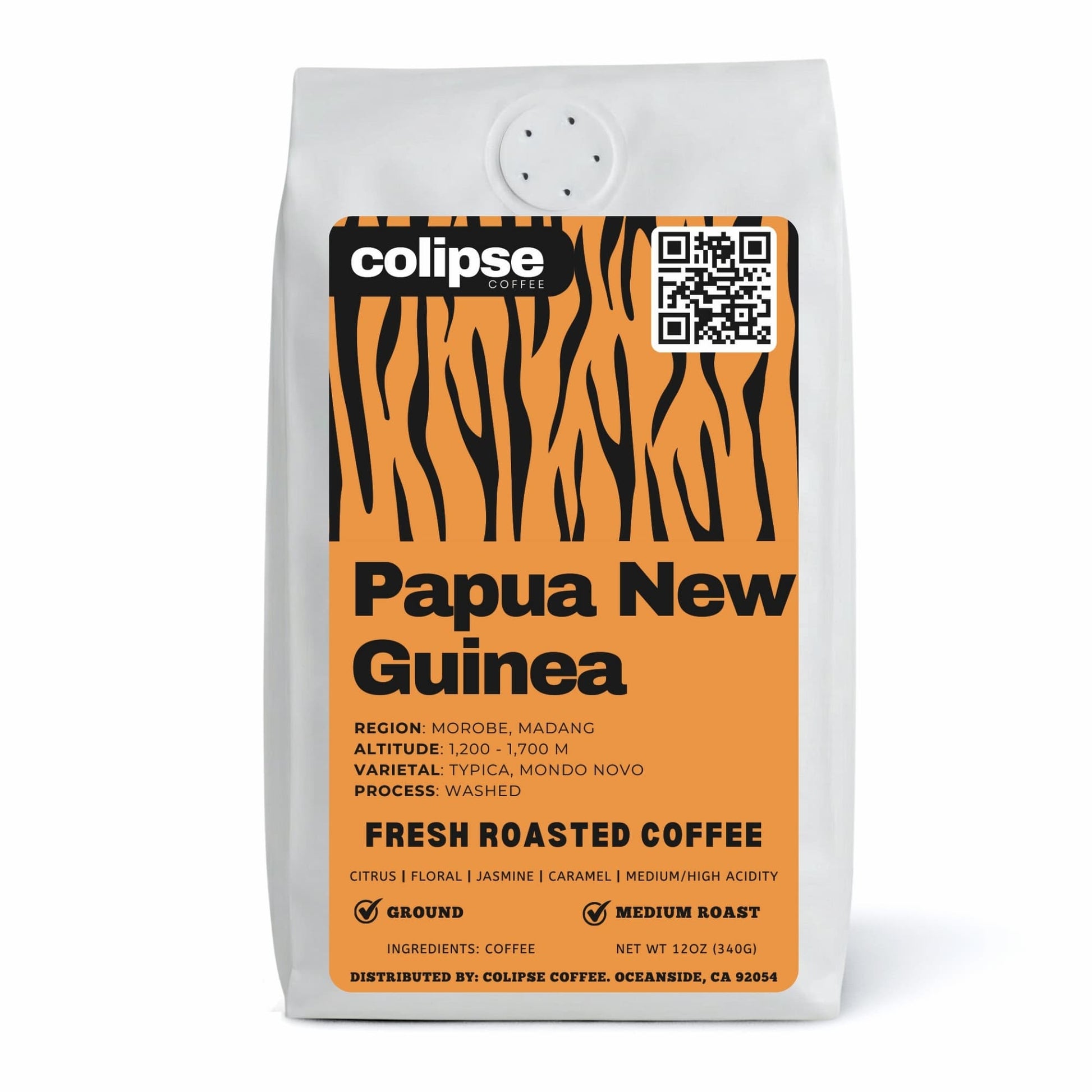 A bag of Colipse Papua New Guinea coffee grounds with deep, complex notes.