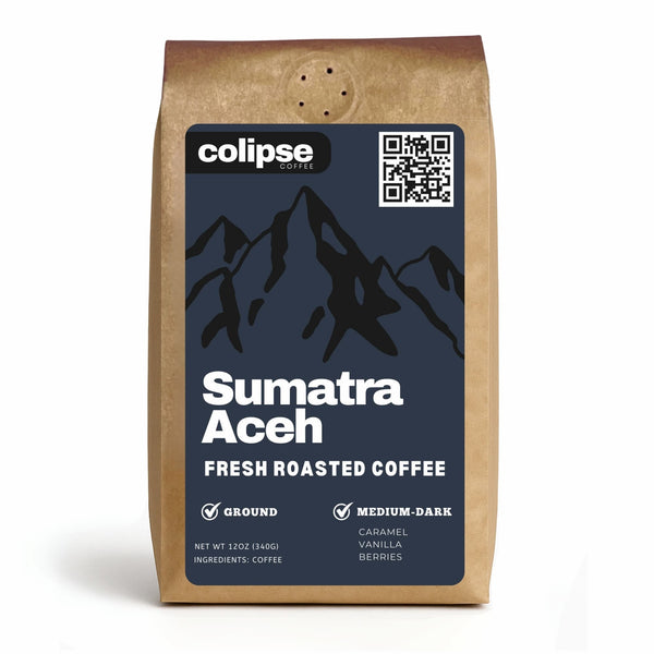 A bag of Colipse Sumatra Aceh fresh roasted coffee with a mountain design and a QR code. The coffee is ground and has medium-dark roast attributes.