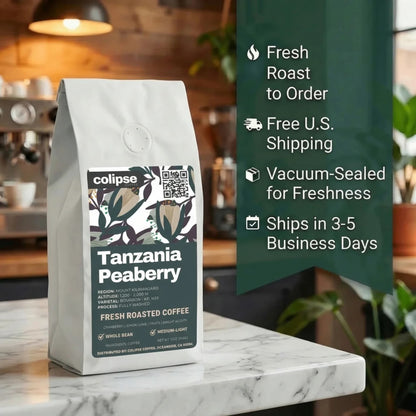 Coffee bag labeled 'Tanzania Peaberry' with promotional text on a kitchen counter.